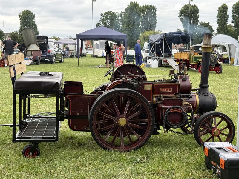 Nellie standing on the showground between events, her nameplate and Crimson Lake paintwork gleaming